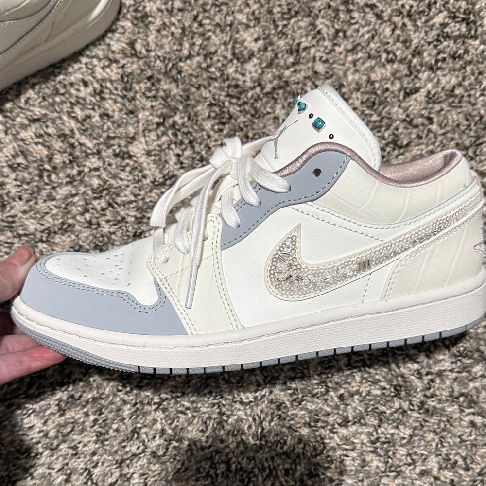 Stylish Cream and Gray Sneakers with Embellished Swoosh